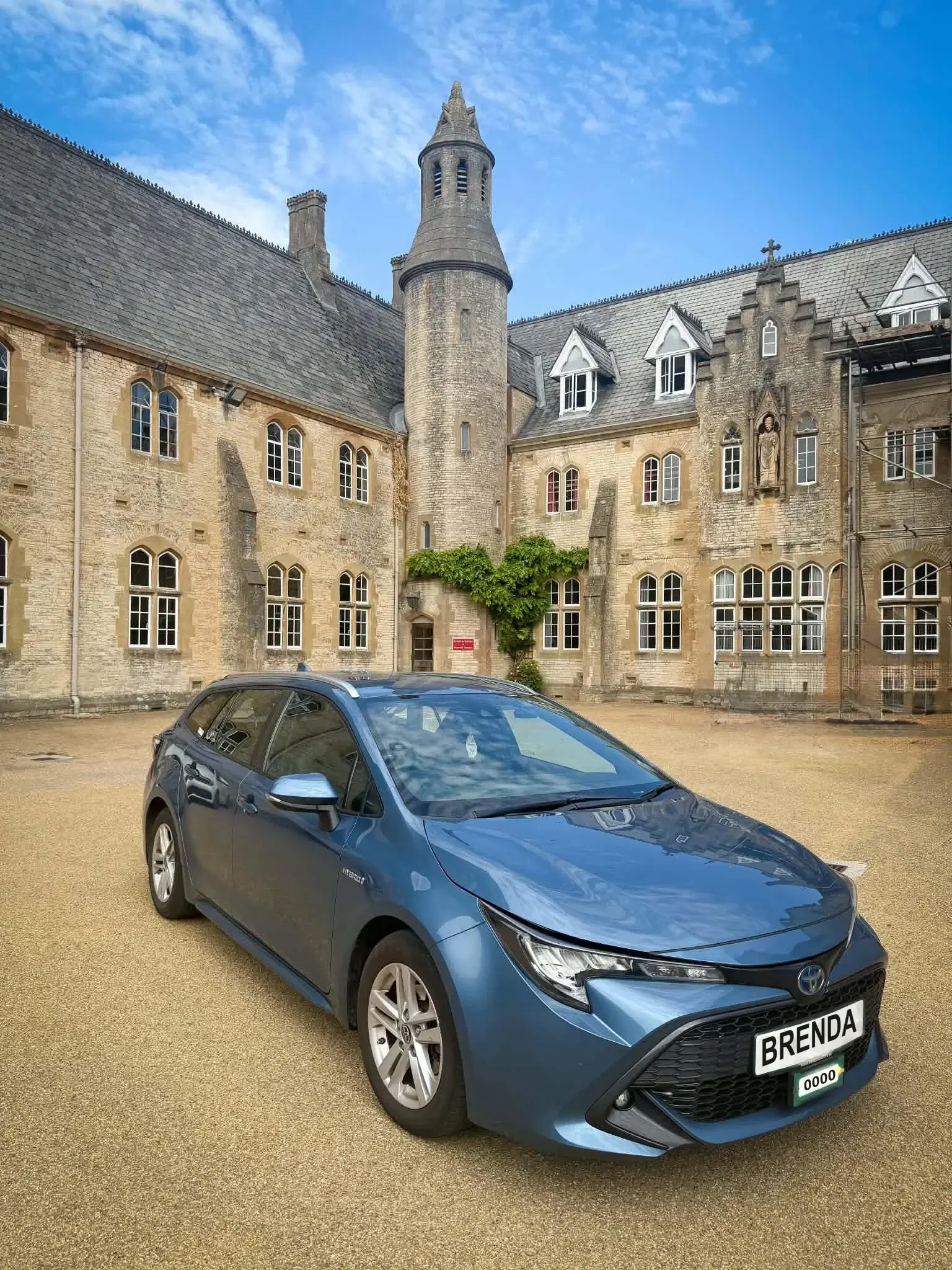Toyota Corolla Touring Sports Hybrid in blue, front three-quarter view